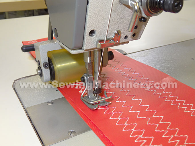 Zigzag sewing machine with puller feed